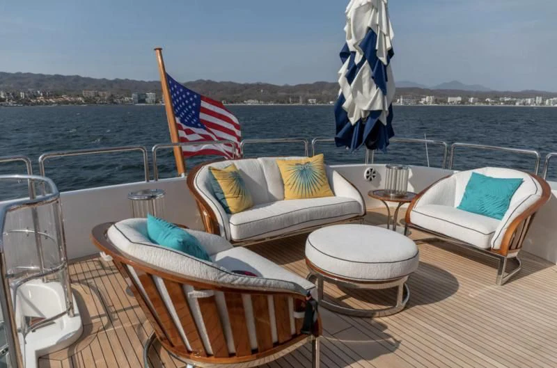 a couple of beds on a deck overlooking a body of water aboard FELICITA Yacht for Sale
