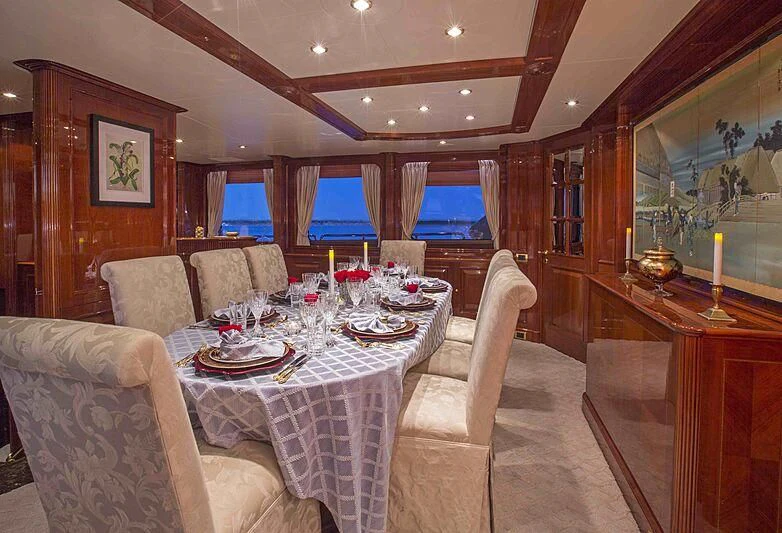a dining room with a table and chairs aboard FELICITA Yacht for Sale