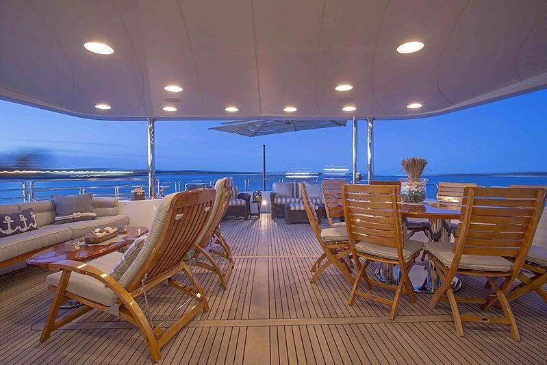 a large room with chairs and a table aboard FELICITA Yacht for Sale