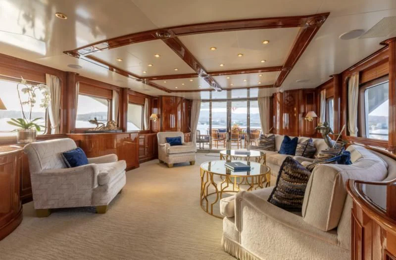 a large living room with a large window aboard FELICITA Yacht for Sale