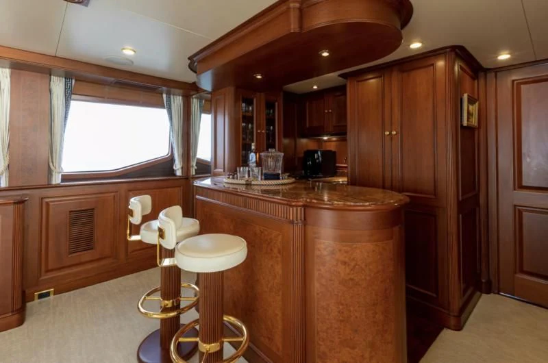 a kitchen with wooden cabinets aboard FELICITA Yacht for Sale