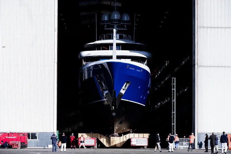 a large blue object with people walking around it aboard M&EM Yacht for Sale