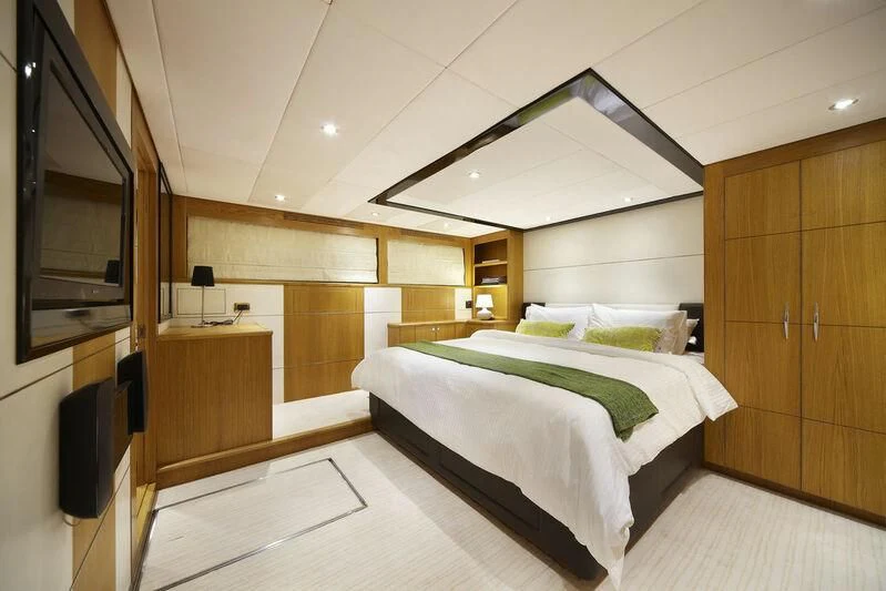 a room with a bed and a desk aboard STAR OF THE SEA Yacht for Sale