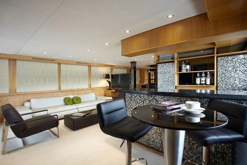 a room with a table and chairs aboard STAR OF THE SEA Yacht for Sale