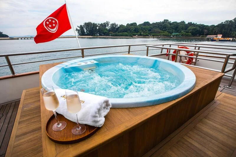 a table with a flag on it aboard STAR OF THE SEA Yacht for Sale