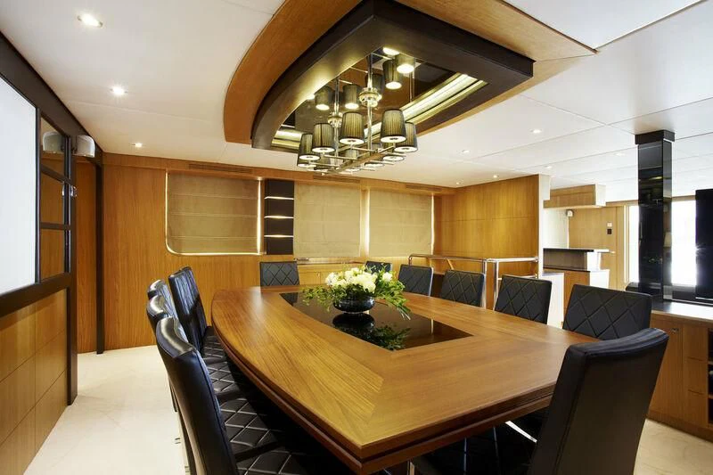 a large room with a table and chairs aboard STAR OF THE SEA Yacht for Sale