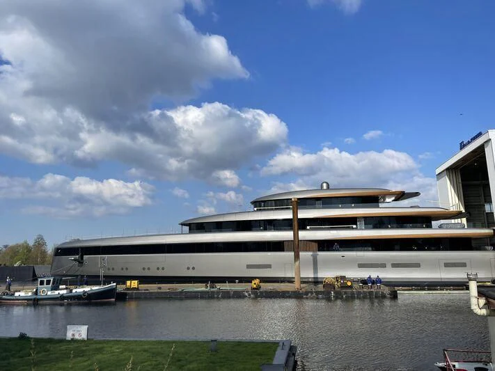 a large cruise ship docked aboard OBSIDIAN Yacht for Sale