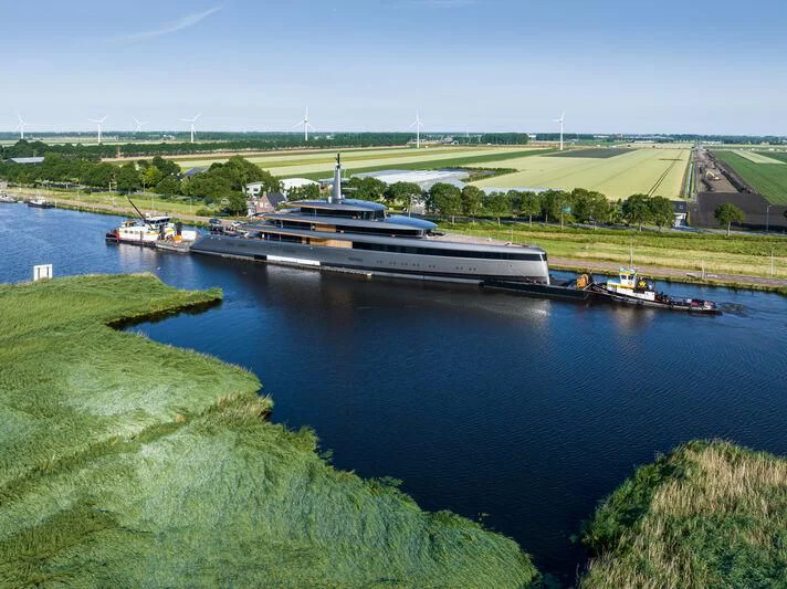 a body of water with boats and buildings along it aboard OBSIDIAN Yacht for Sale