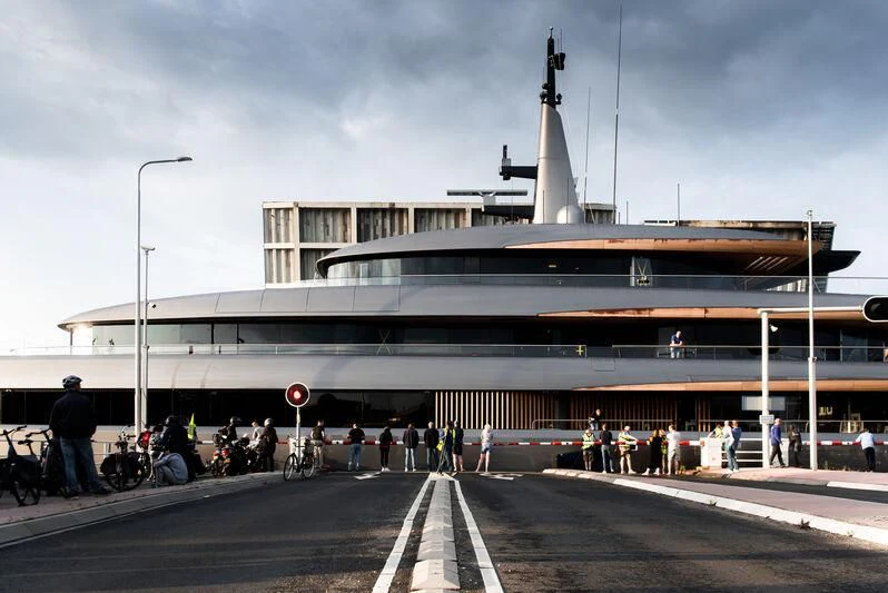 a group of people outside a building aboard OBSIDIAN Yacht for Sale