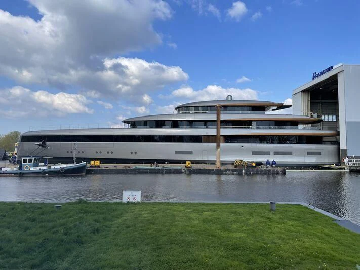a large building with a boat in the water aboard OBSIDIAN Yacht for Sale