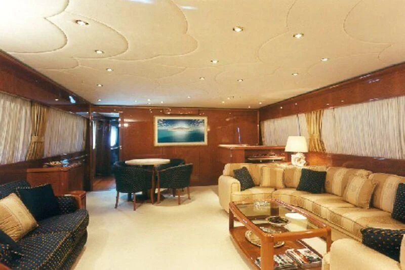 a living room with a couch and a table aboard CHARLY BOY Yacht for Sale