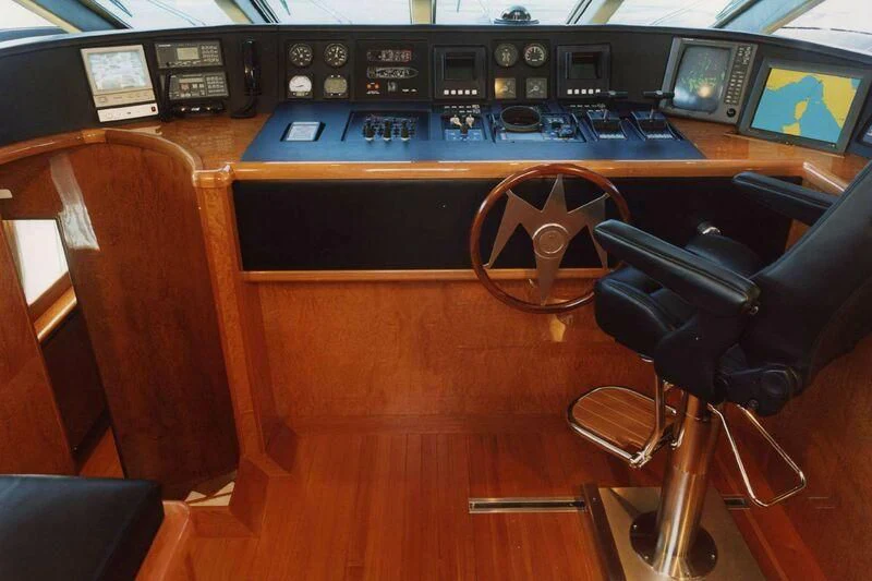 a black chair in front of a black computer desk aboard CHARLY BOY Yacht for Sale