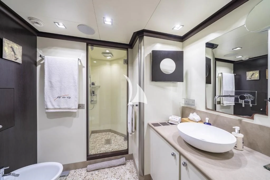 a bathroom with a sink and a mirror aboard QUID PRO QUO Yacht for Sale