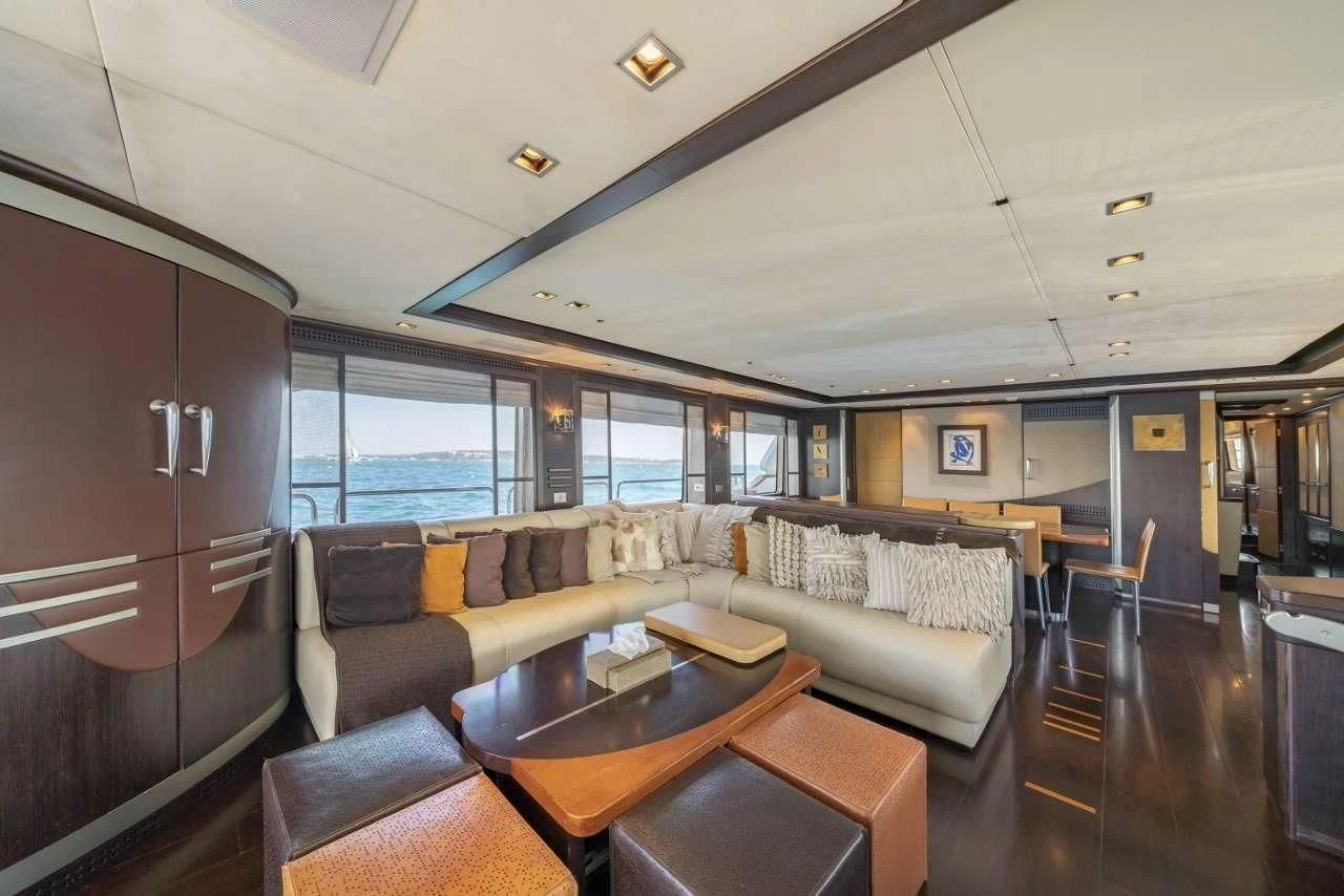 a living room with a couch and a table aboard QUID PRO QUO Yacht for Sale