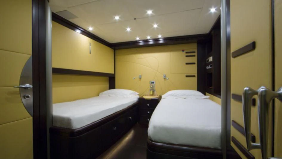 a room with bunk beds aboard QUID PRO QUO Yacht for Sale