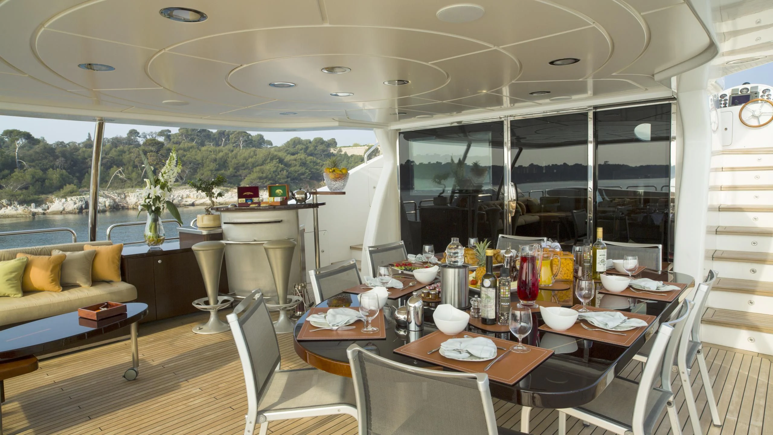 a dining room with a table and chairs aboard QUID PRO QUO Yacht for Sale