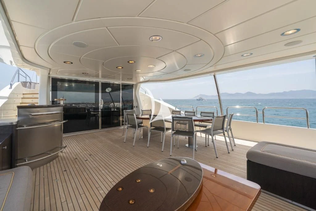 a large boat on the water aboard QUID PRO QUO Yacht for Sale