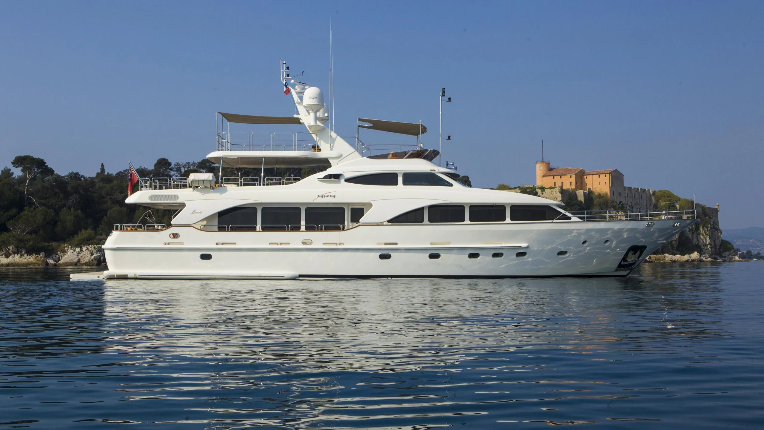 a white yacht on the water aboard QUID PRO QUO Yacht for Sale