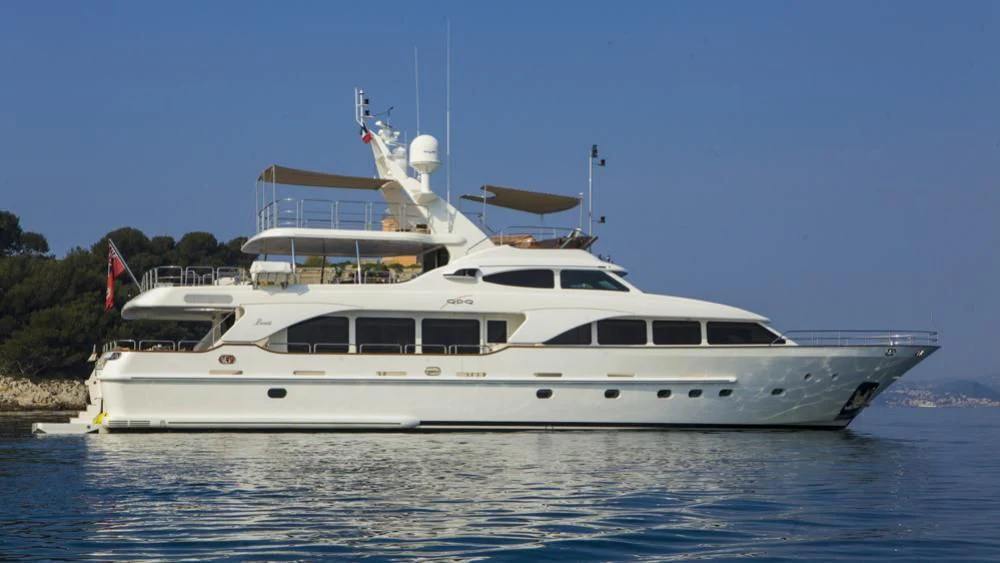 a white yacht on the water aboard QUID PRO QUO Yacht for Sale