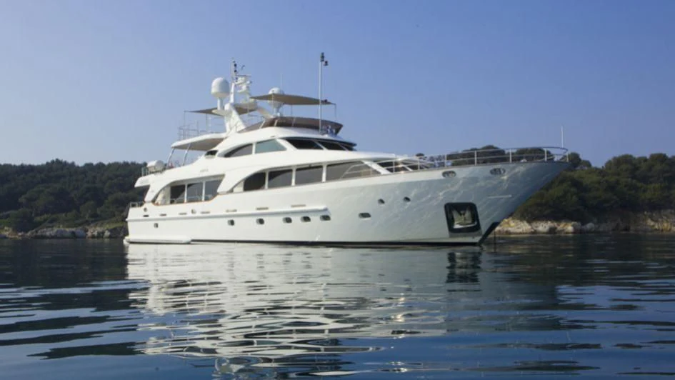 a white yacht on the water aboard QUID PRO QUO Yacht for Sale