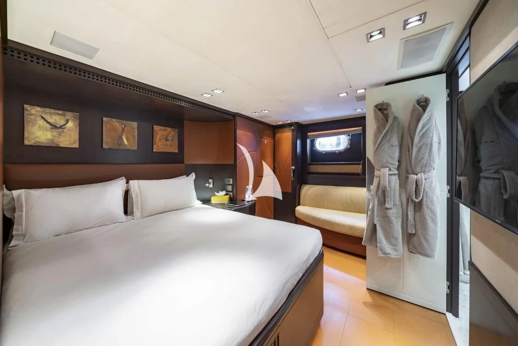 a hotel room with a bed aboard QUID PRO QUO Yacht for Sale