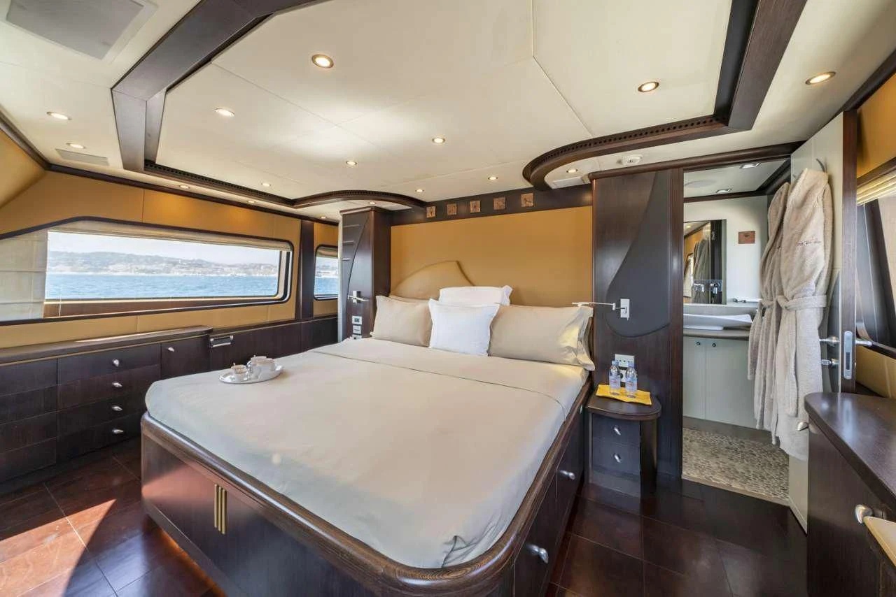 a bed in a room aboard QUID PRO QUO Yacht for Sale