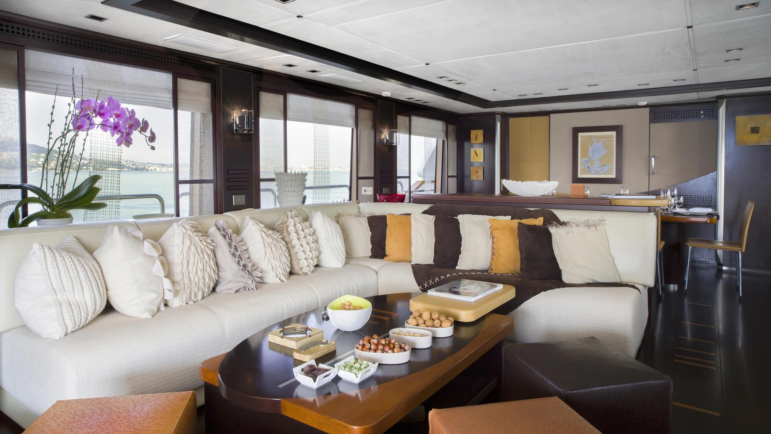a living room with a couch and a table aboard QUID PRO QUO Yacht for Sale