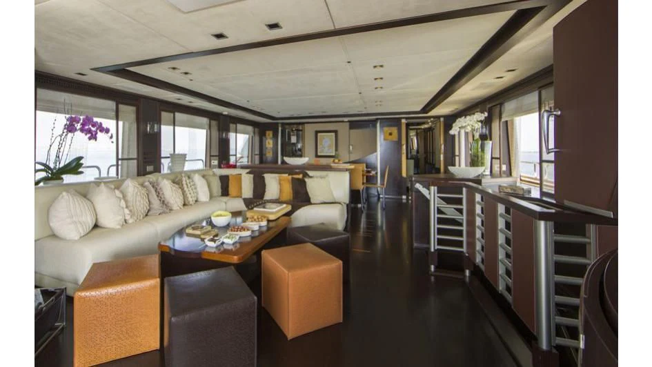 a living room with a couch and a table aboard QUID PRO QUO Yacht for Sale