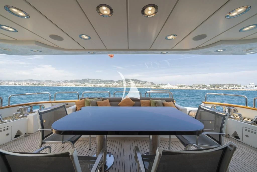 a boat with blue seats aboard QUID PRO QUO Yacht for Sale
