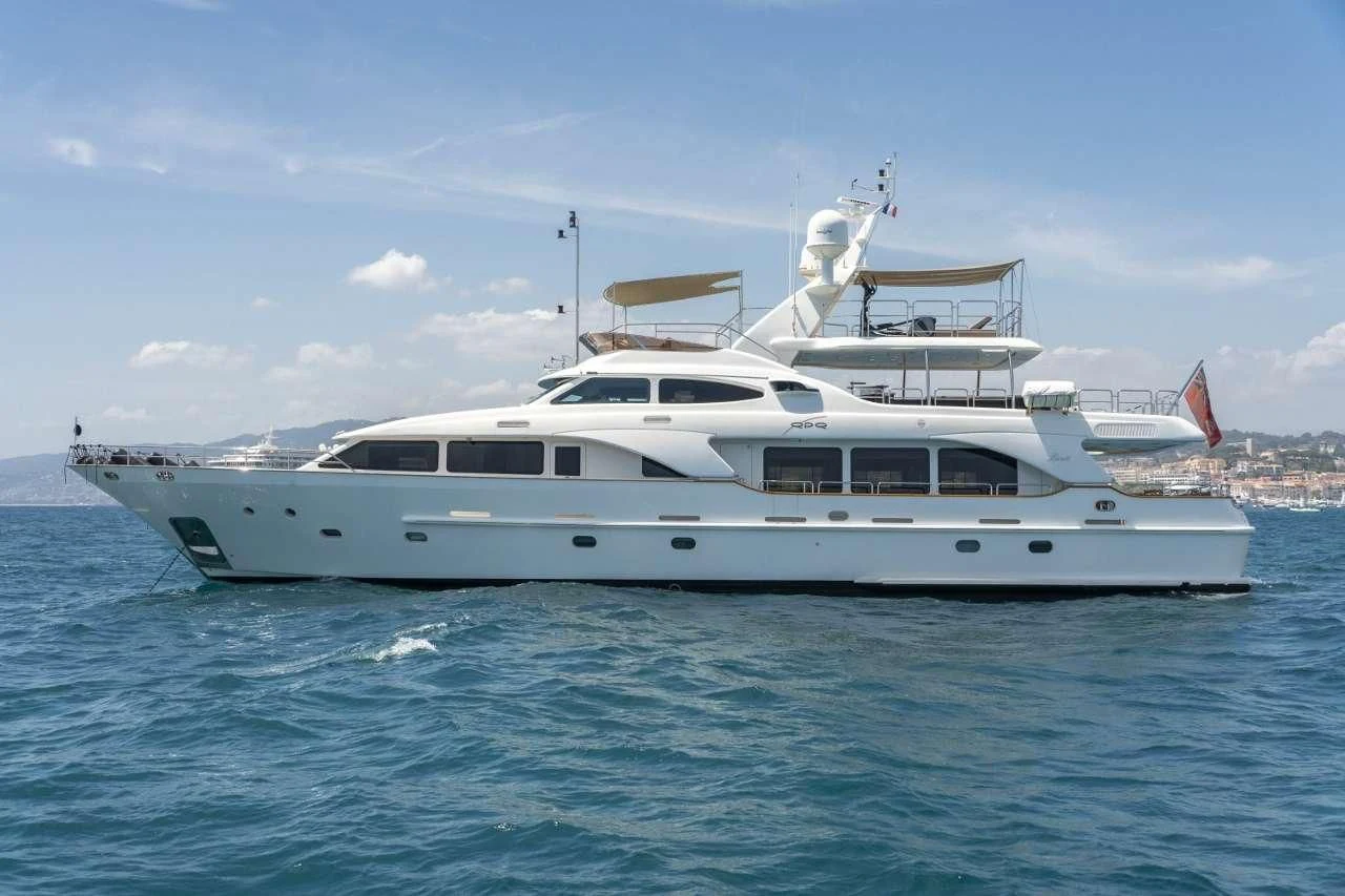 a white yacht in the water aboard QUID PRO QUO Yacht for Sale