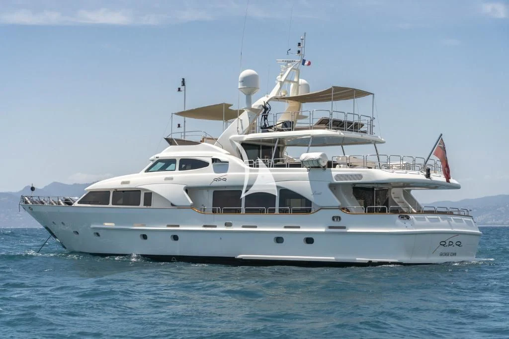 a white yacht in the water aboard QUID PRO QUO Yacht for Sale