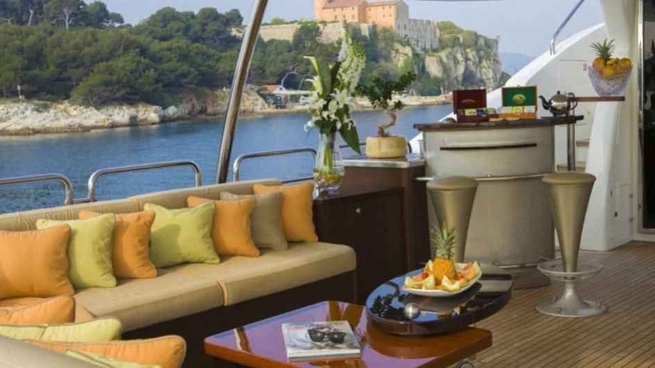 a living room with a large balcony aboard QUID PRO QUO Yacht for Sale