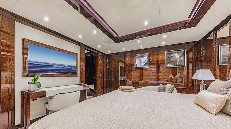 a large bed in a room aboard SPECTRE Yacht for Sale