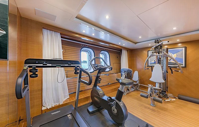 a gym with exercise equipment aboard SPECTRE Yacht for Sale