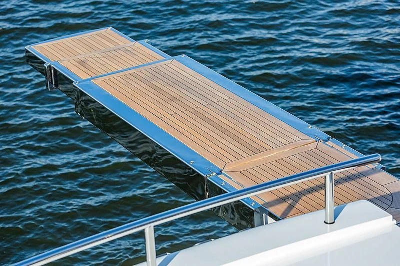 a wooden dock over water aboard SPECTRE Yacht for Sale