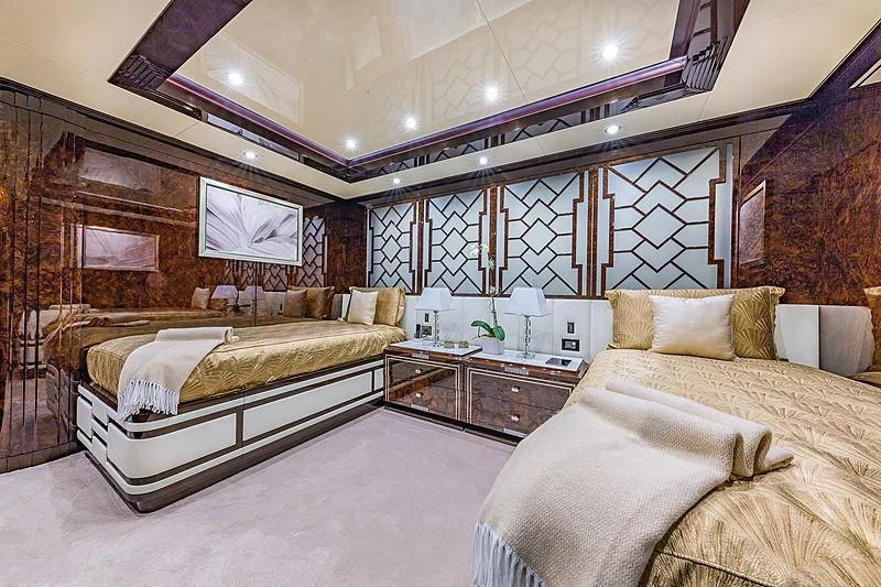 a room with a bed and a mirror aboard SPECTRE Yacht for Sale