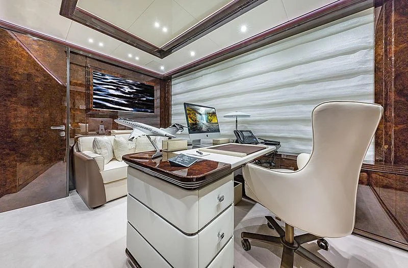 a room with a desk and a chair aboard SPECTRE Yacht for Sale