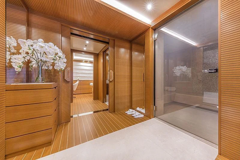 a large room with a large mirror and a large white counter aboard SPECTRE Yacht for Sale