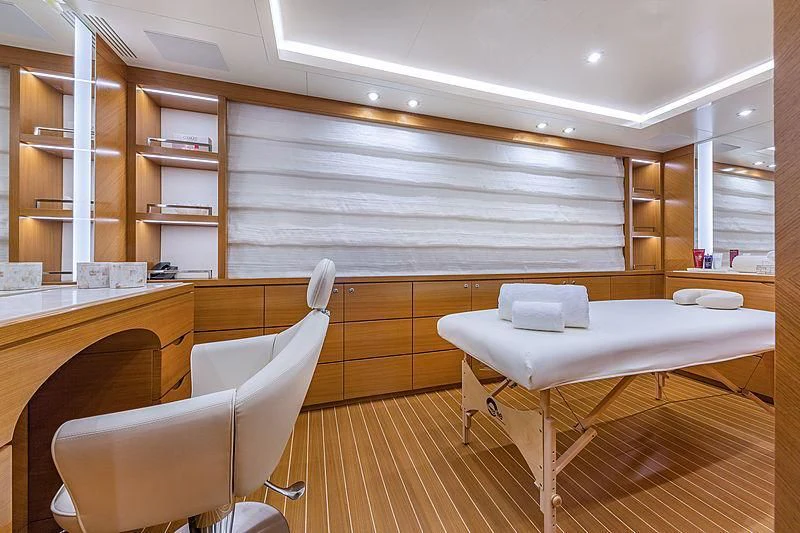 a room with a bed and a desk aboard SPECTRE Yacht for Sale