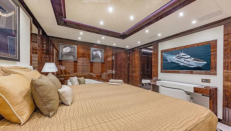a large bed in a room aboard SPECTRE Yacht for Sale
