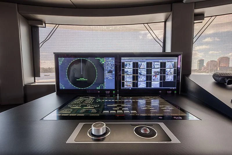 a computer with a monitor and keyboard aboard SPECTRE Yacht for Sale