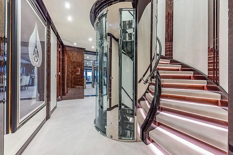 a hallway with a row of doors aboard SPECTRE Yacht for Sale