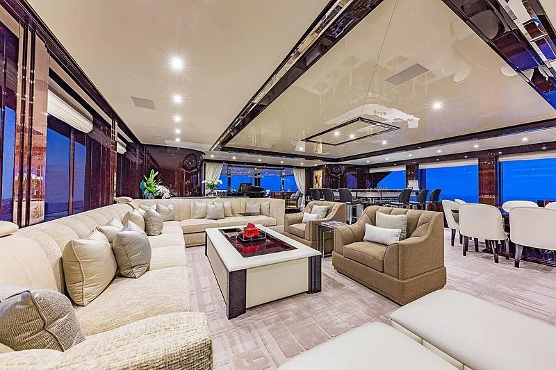 a large living room with a large window aboard SPECTRE Yacht for Sale