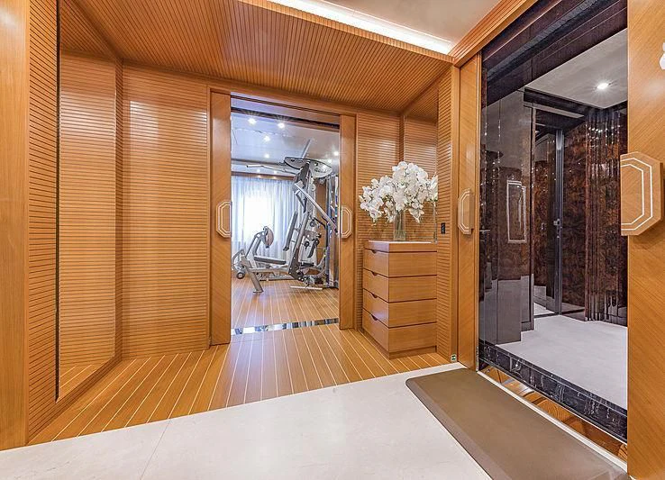 a large room with a large mirror aboard SPECTRE Yacht for Sale
