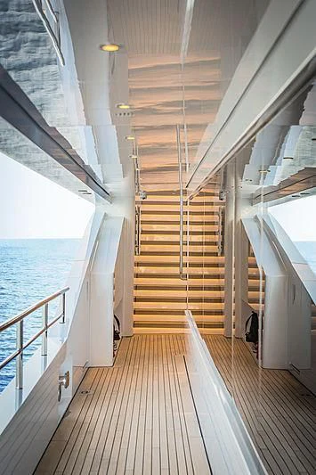 a wood bridge over a body of water aboard SPECTRE Yacht for Sale