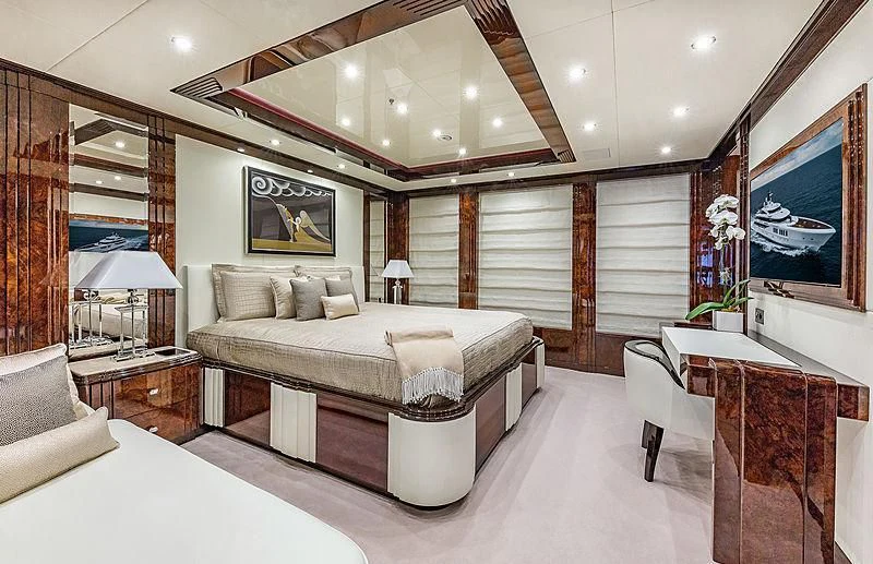 a large bedroom with a large bed aboard SPECTRE Yacht for Sale