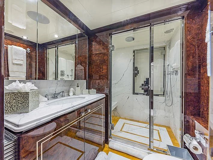 a bathroom with a large mirror aboard SPECTRE Yacht for Sale