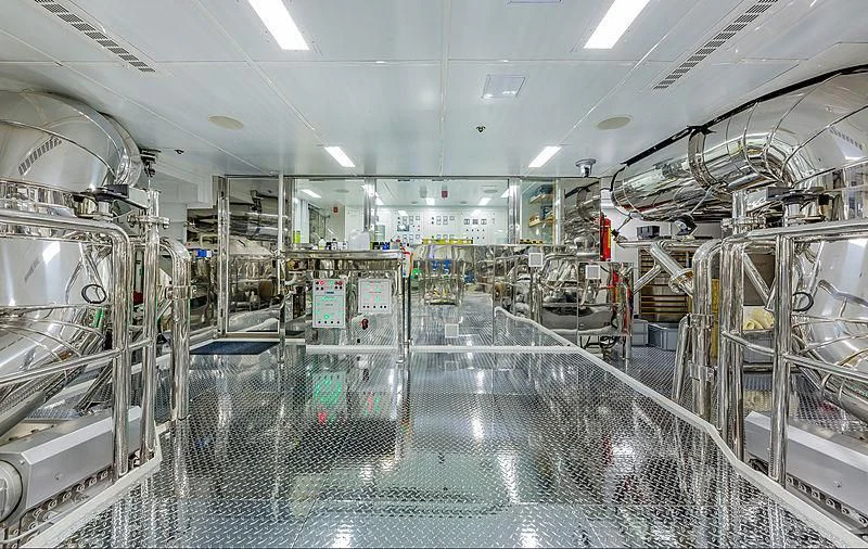 a large factory with many machines aboard SPECTRE Yacht for Sale