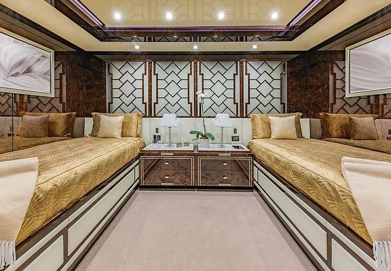 a room with a bed and a mirror aboard SPECTRE Yacht for Sale