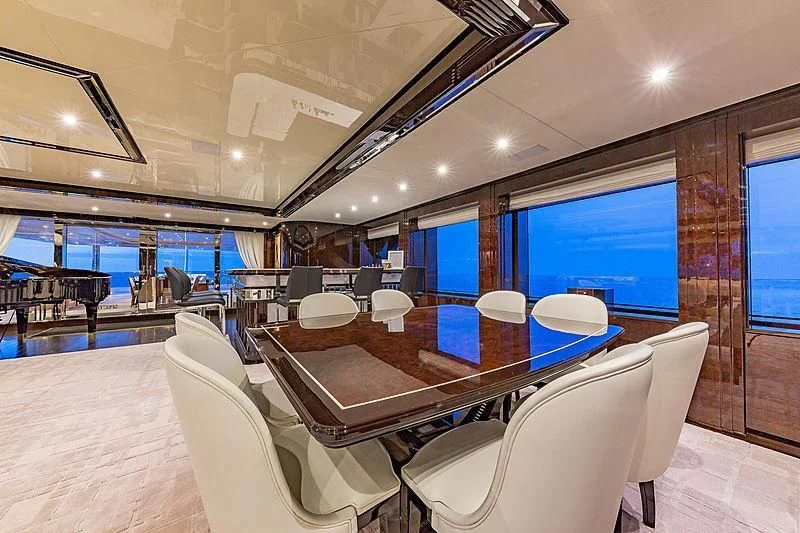 a room with a table and chairs aboard SPECTRE Yacht for Sale